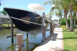 boat lifts off of home deck | Naples Marine Construction - Naples, Florida