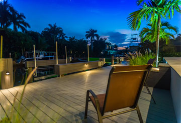 about us home block - two chairs on a Naples Marine Construction deck | Naples Marine Construction - Naples, Florida